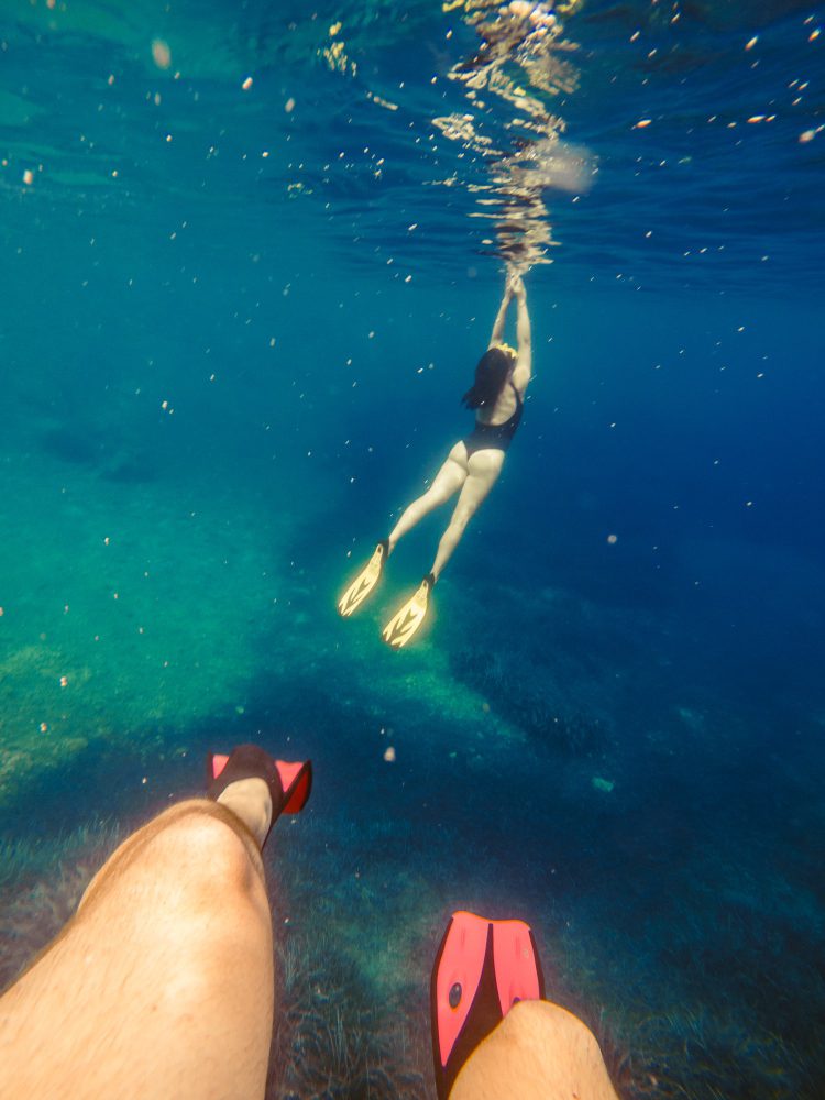 Couple Swimming Underwater